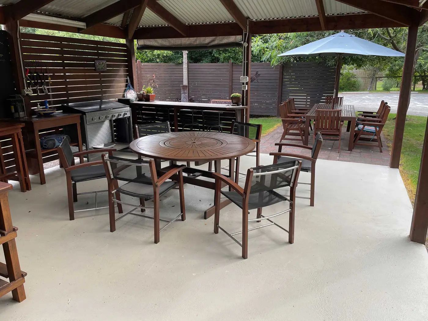 The covered BBQ pavilion with long dining tables