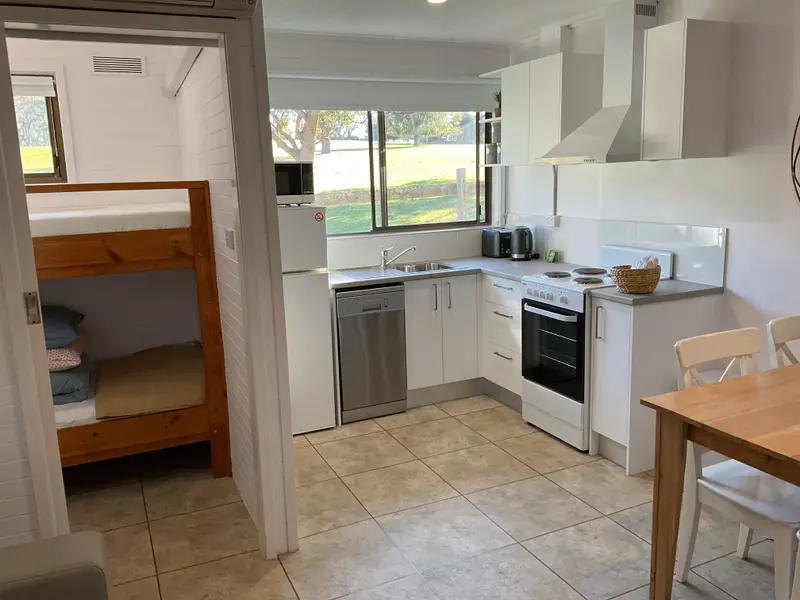 Studio 1 white kitchen with oven and dishwasher