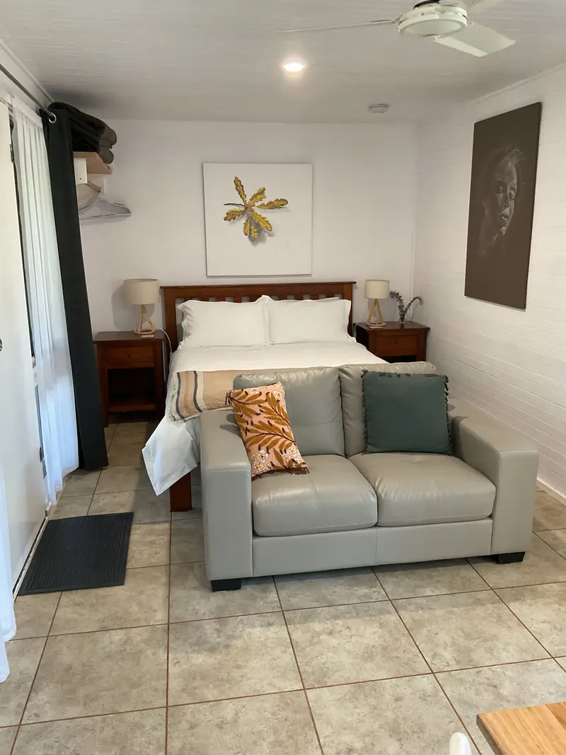 Studio 1 main room with queen bed and sofa