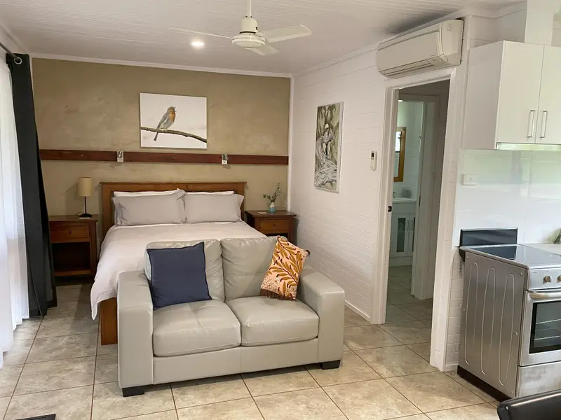 Deluxe 4 main room with queen bed