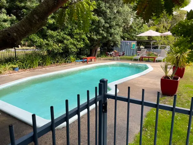 Fenced swimming pool in the garden